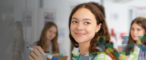girl writing on whiteboard