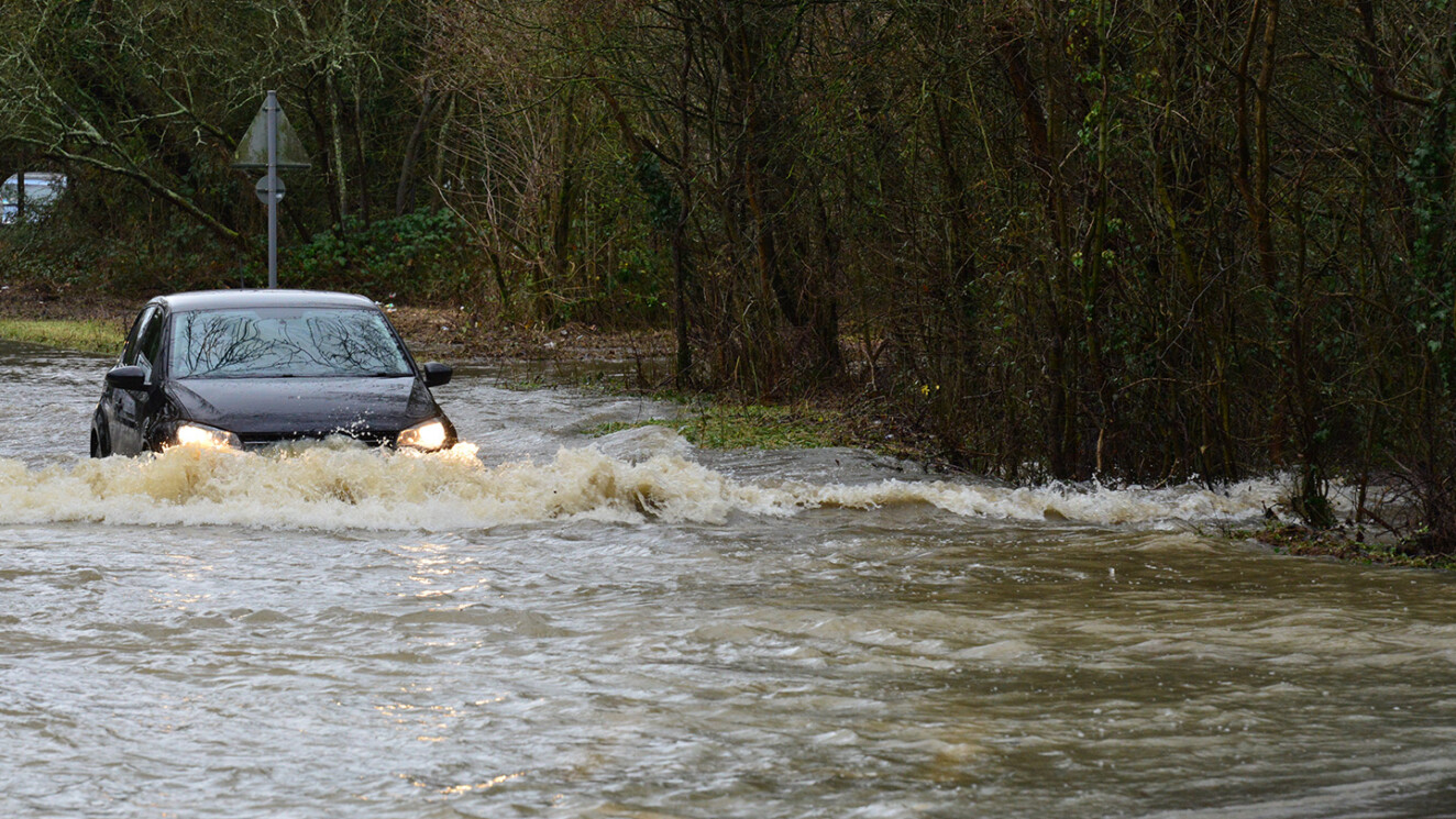car passing through floodwater