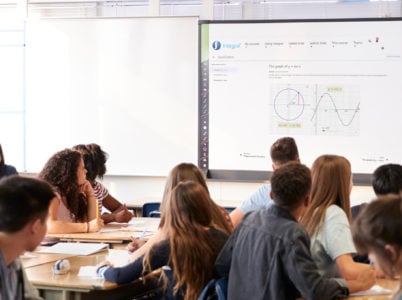 Female teacher teaching trigonometry to class of students