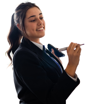 teenage pupil writing on whiteboard