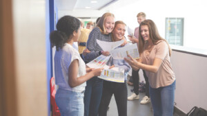 students celebrating exam result success
